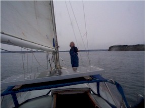 Sara on the bow, setting the genoa